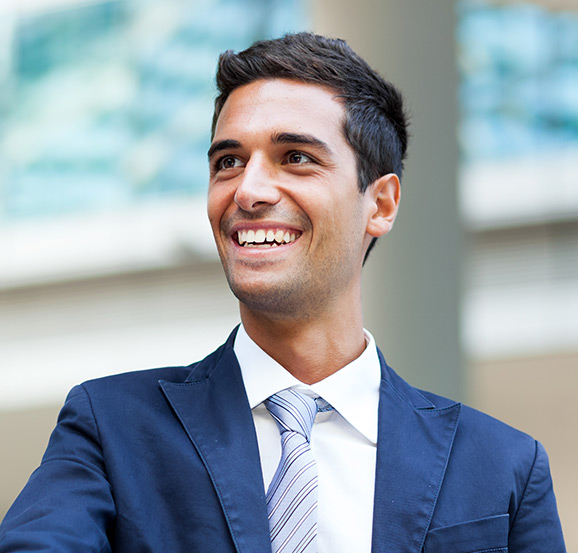 Smiling person in a blue suit